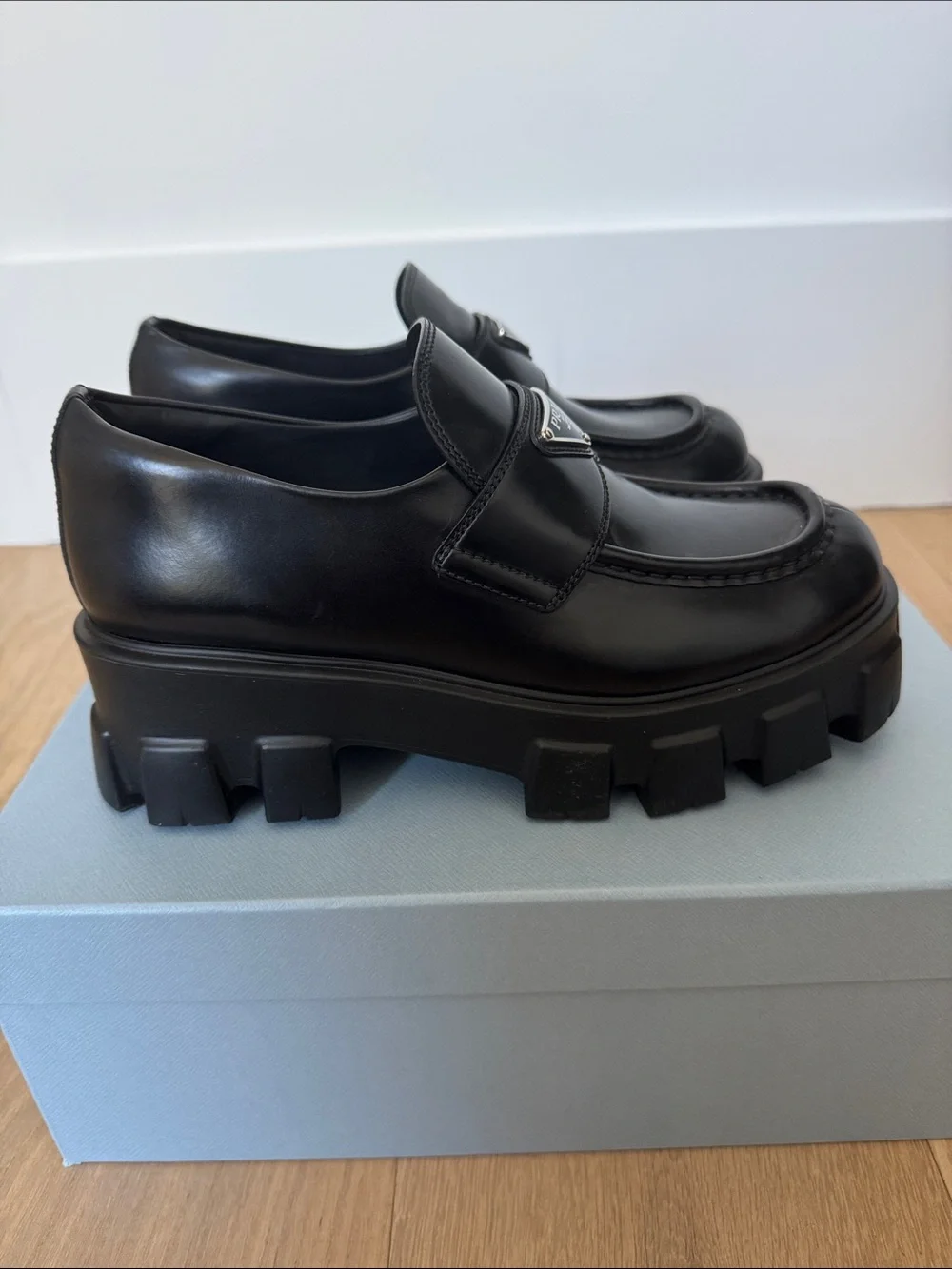 Prada Monolith leather loafer with rubber sole.